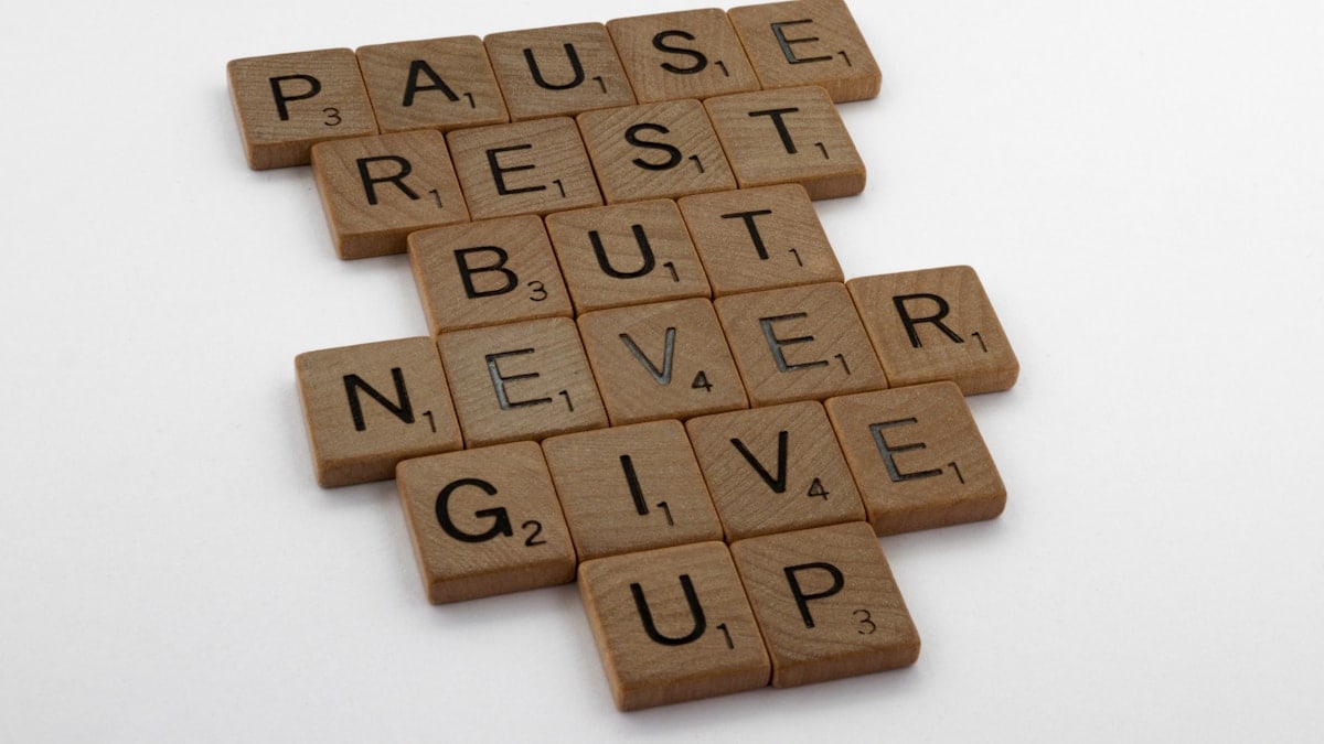 scrabble, scrabble pieces, lettering, letters, wood, scrabble tiles, white background, words, quote, letters, type, typography, design, layout, pause, rest, keep going, never give up, progress, persistence, inexorable, one day at a time, this too shall pass, momentary, pressing on, don't give up, carry on, hope, faith, good times, bad times, perseverance, don't give up, never give up, emotional storm, covid,